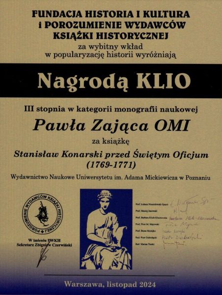 Tabliczka pamiątkowa z informacją o przyznaniu nagrody o. prof. Pawłowi Zającowi OMI